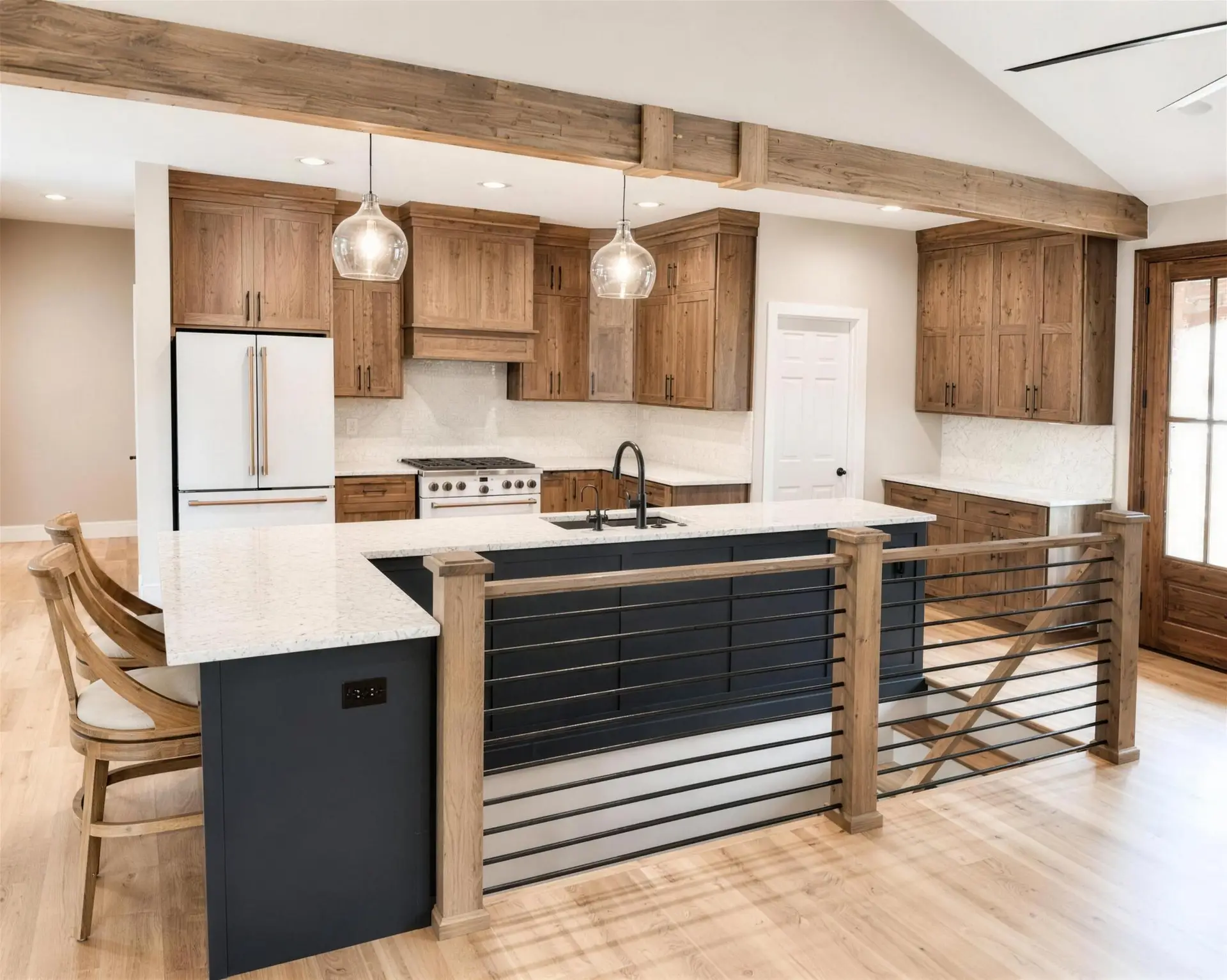 Kitchen design illustration with rustic wood cabinets, a navy island topped in quartz, cable railing, and a vaulted ceiling with exposed wood beams